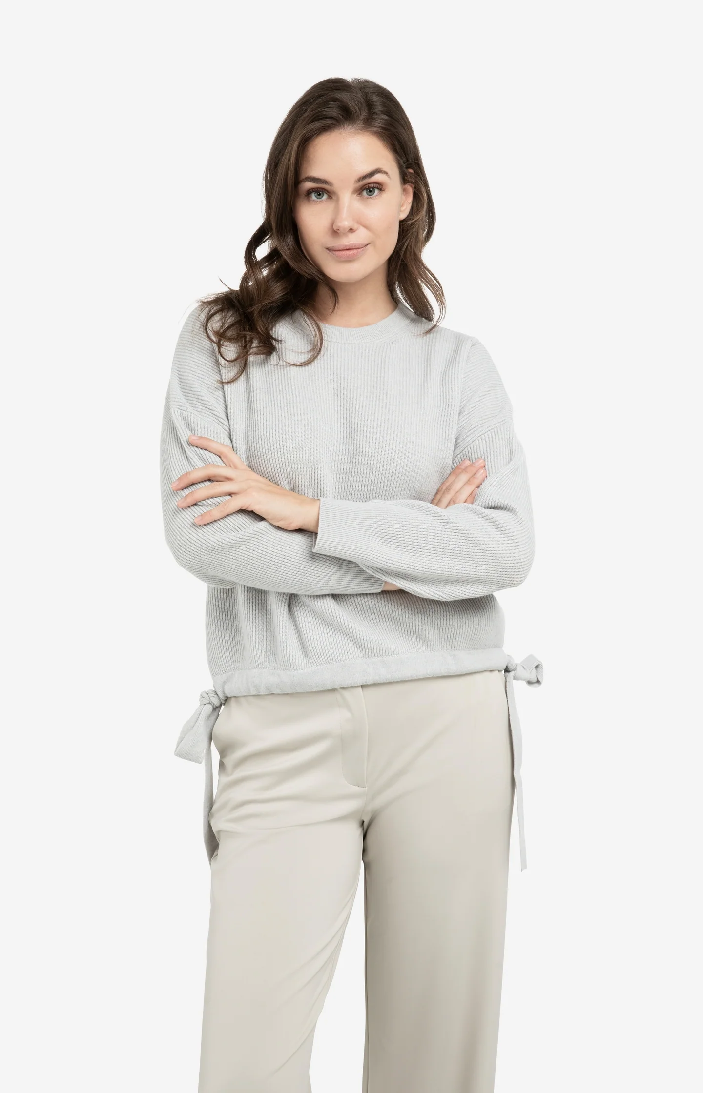 Knitted sweater with tie details at the hem