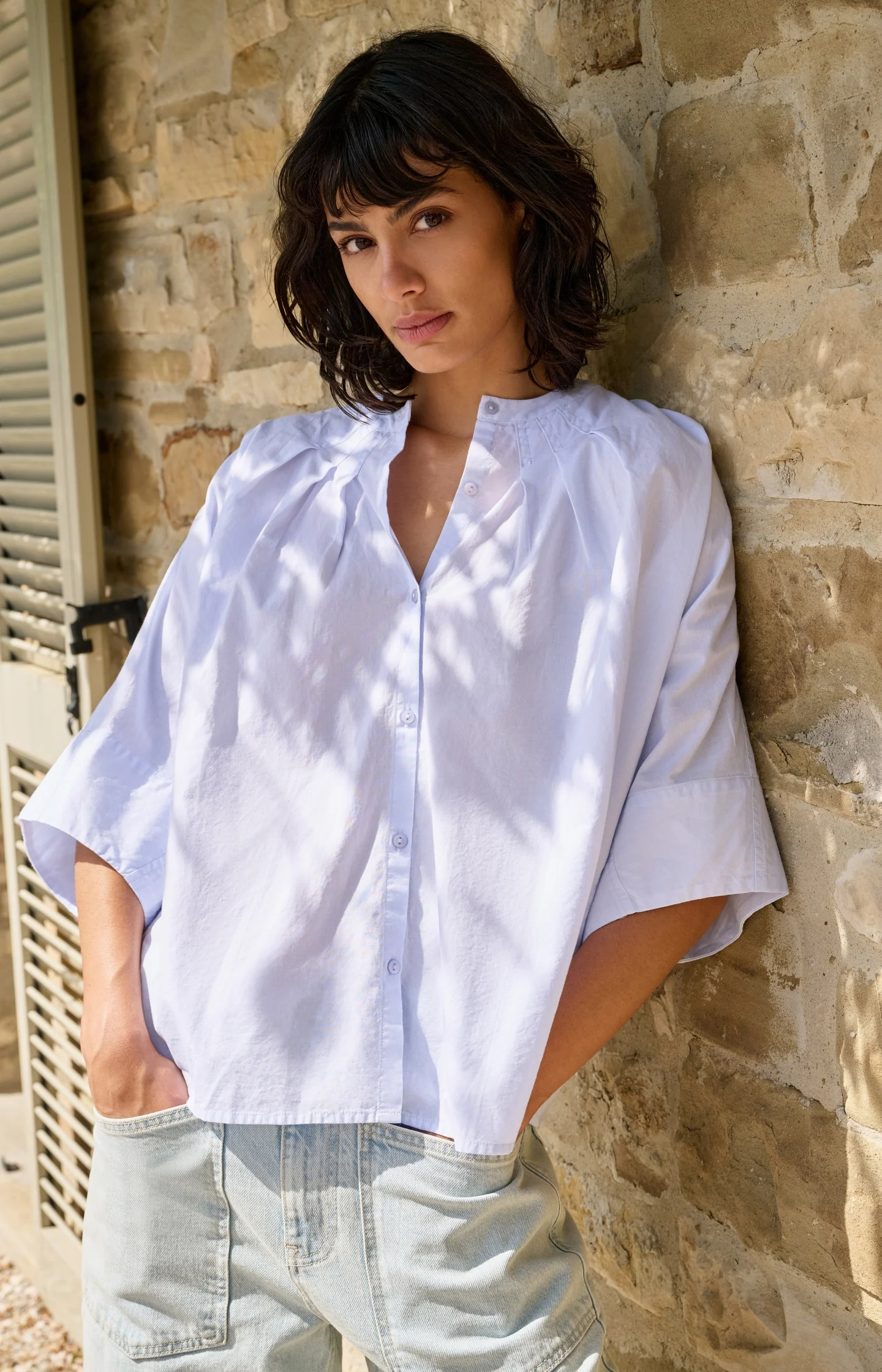 Oversized batwing blouse with pleats and wide sleeves