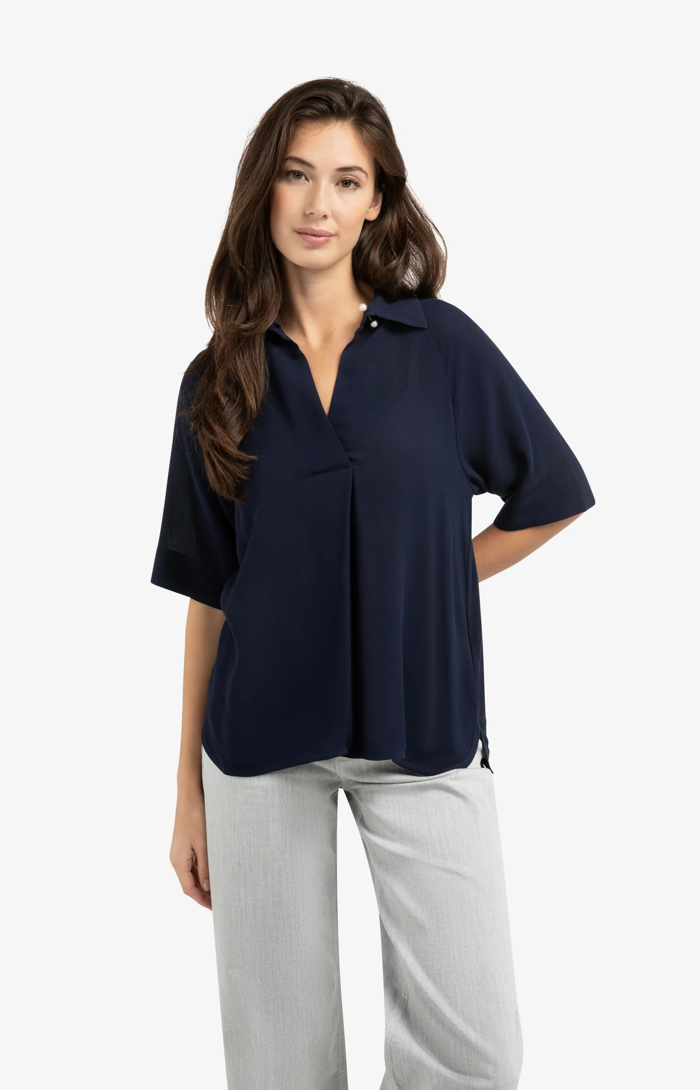 Top with short raglan sleeves and pearl detail